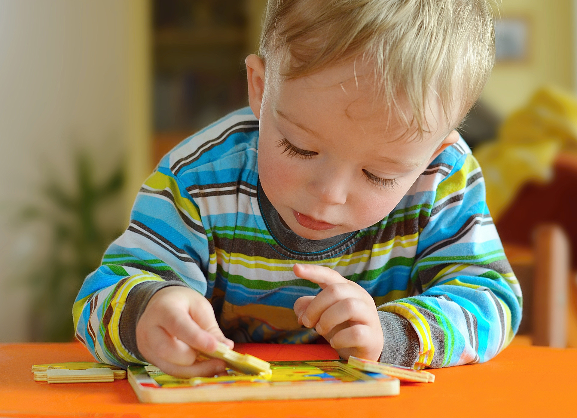child playing with a puzzle